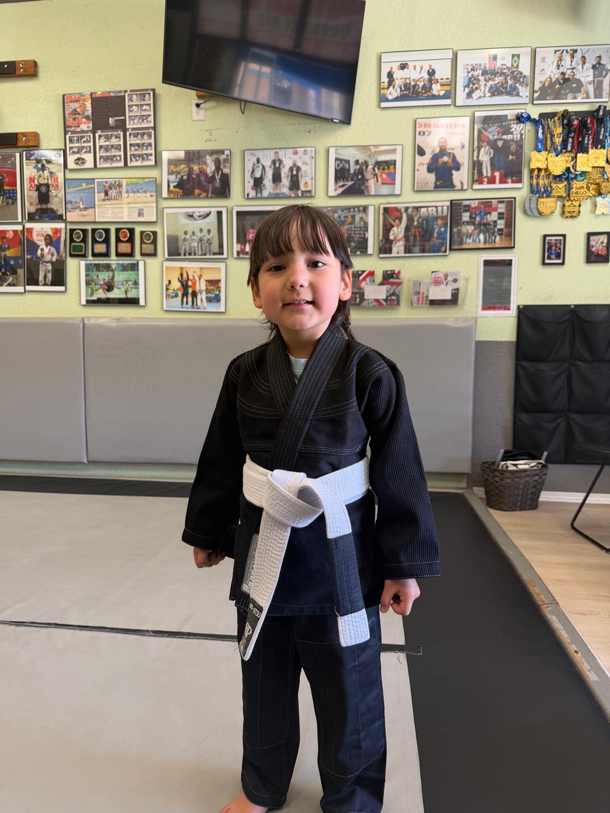 Young MCBJJ student in gi with white belt at the academy in Carson, CA